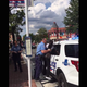 Video footage of a woman being pinned to a police vehicle, her feet dangling above the ground.
Twitter
